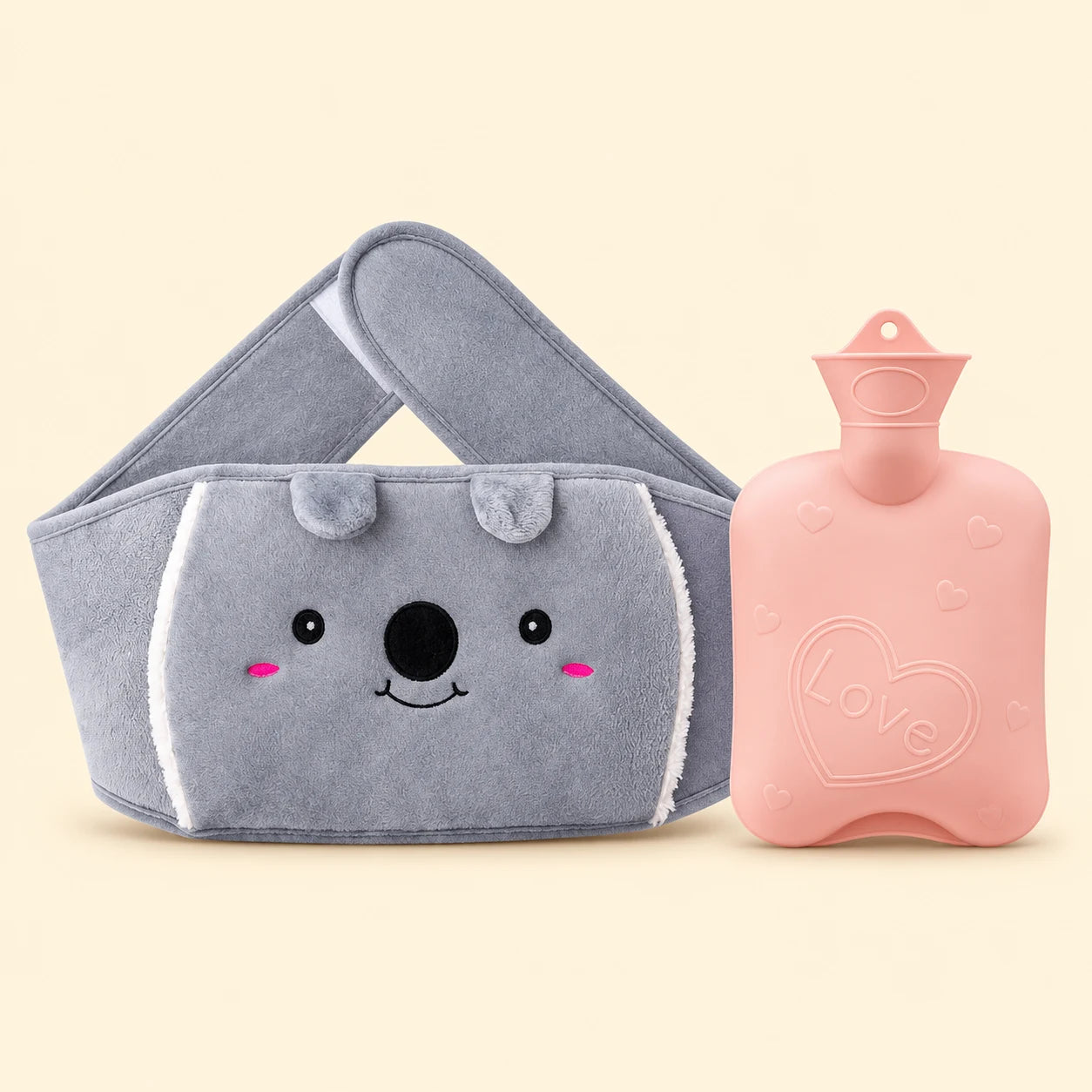 Tam ortada gri koala peluş bel kemeri ve pembe sıcak su torbası